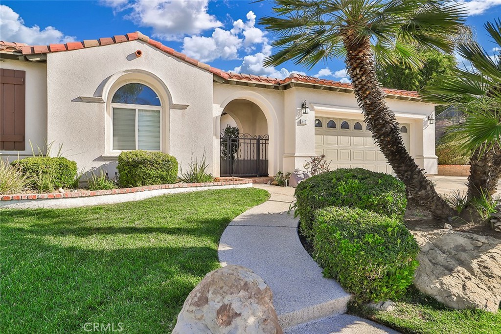 5421 Moonshadow Street Simi Valley, CA 93063 - Photo 5 of 56 a front view of a house with garden