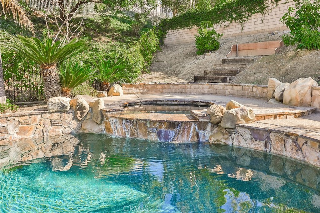 5421 Moonshadow Street Simi Valley, CA 93063 - Photo 54 of 56 a backyard of a house with table and chairs
