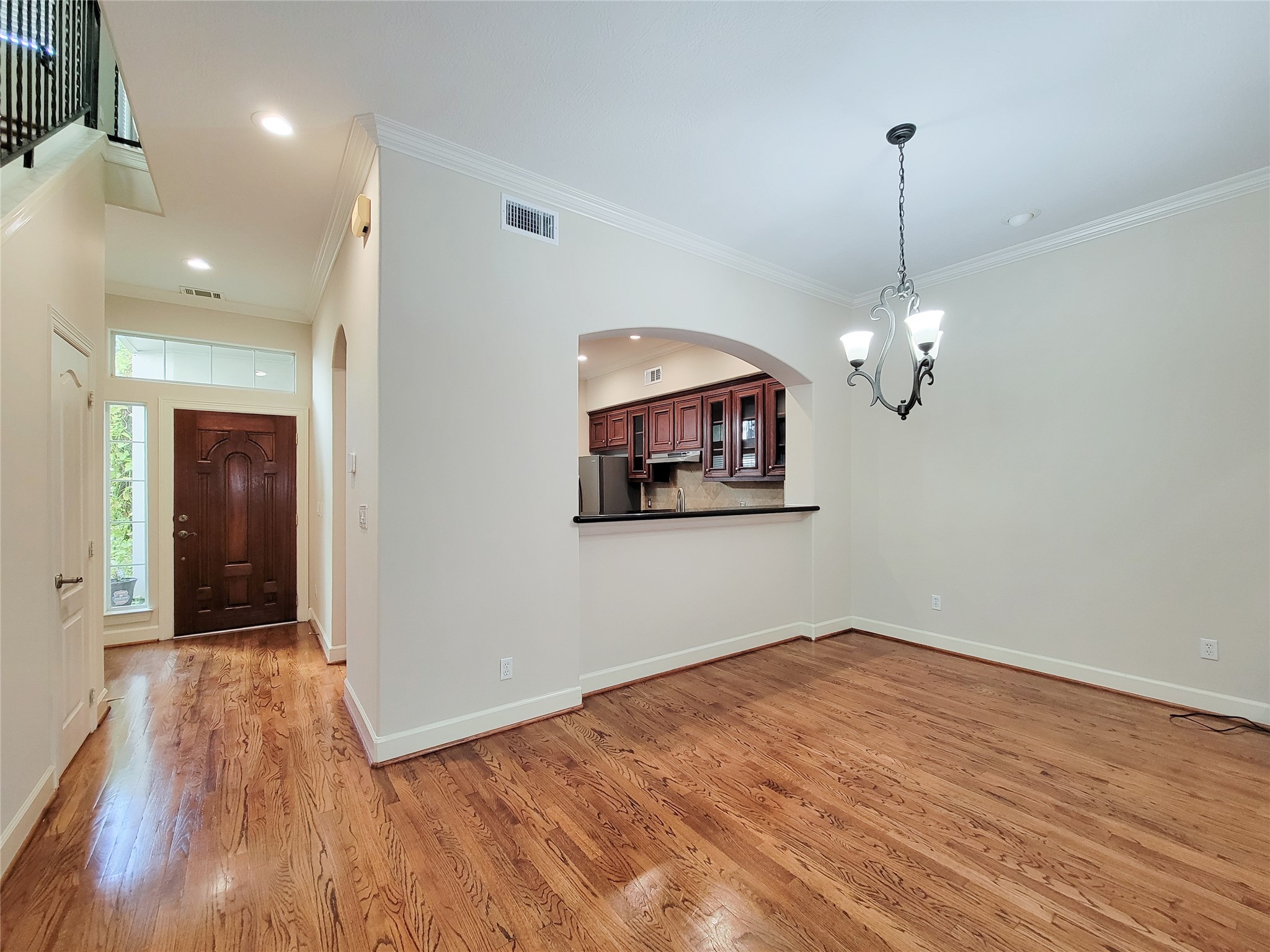 5514 Feagan Street Houston, TX 77007 - Photo 16 of 48 a view of a room with wooden floor chandelier and a ceiling fan