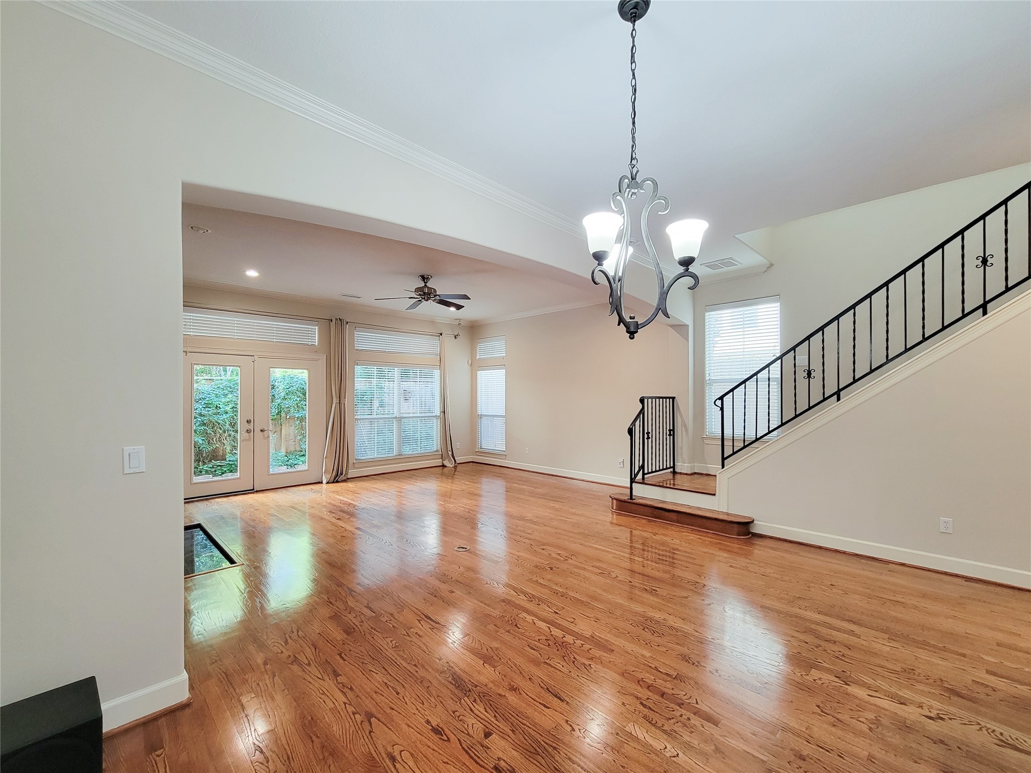 5514 Feagan Street Houston, TX 77007 - Photo 18 of 48 a view of an empty room with wooden floor and a window