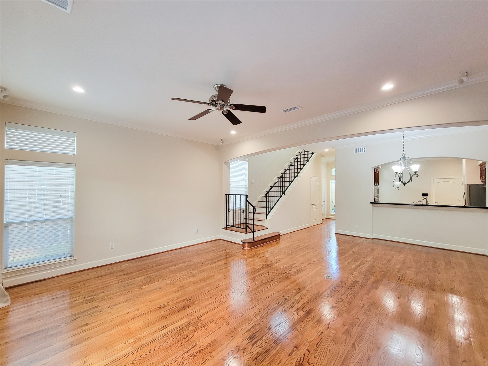5514 Feagan Street Houston, TX 77007 - Photo 21 of 48 a view of an empty room with wooden floor and stairs