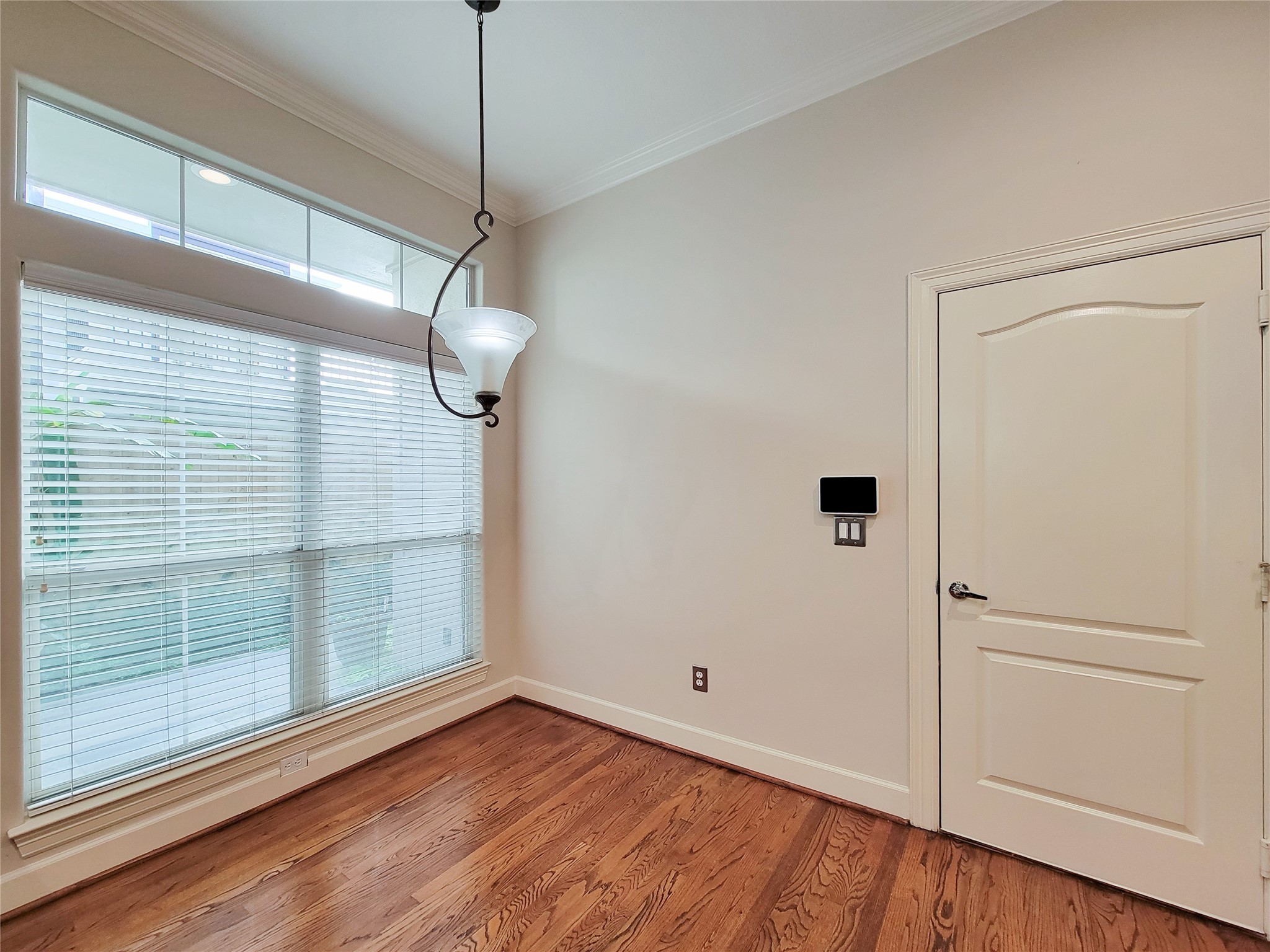 5514 Feagan Street Houston, TX 77007 - Photo 4 of 48 a view of a room with wooden floor and white walls