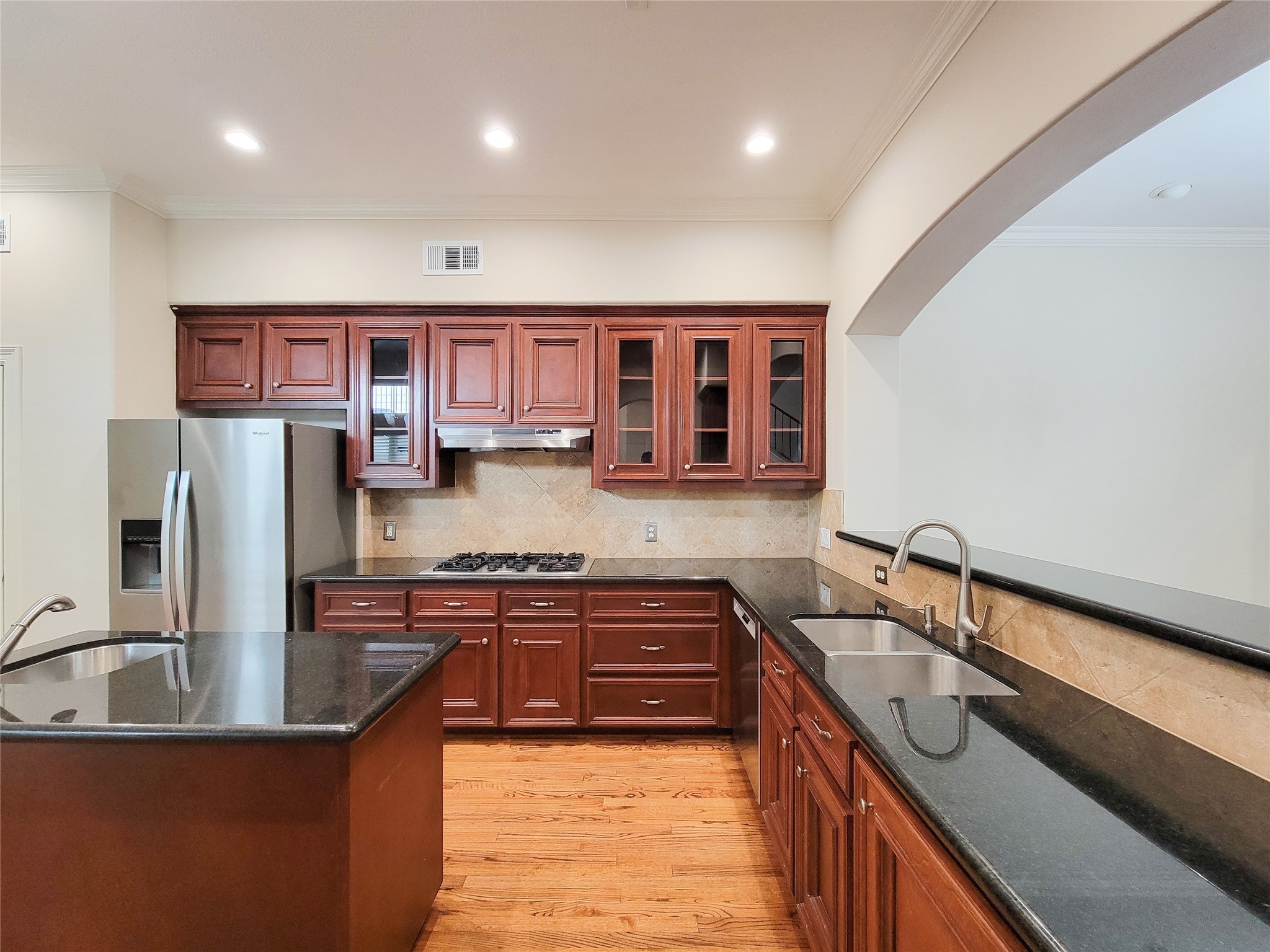 5514 Feagan Street Houston, TX 77007 - Photo 5 of 48 a kitchen with stainless steel appliances granite countertop a sink stove and refrigerator