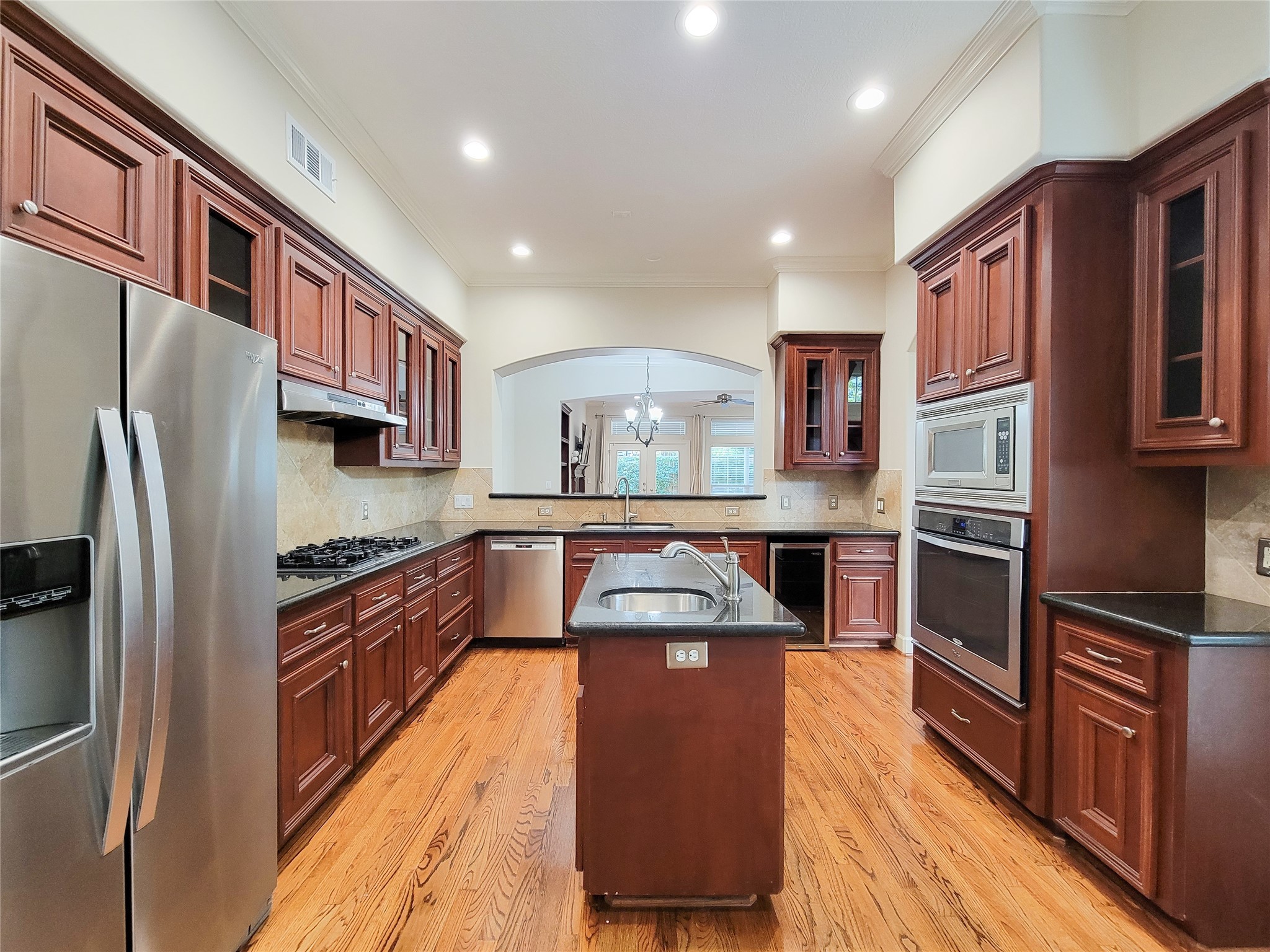 5514 Feagan Street Houston, TX 77007 - Photo 7 of 48 a kitchen with stainless steel appliances granite countertop a refrigerator and a stove