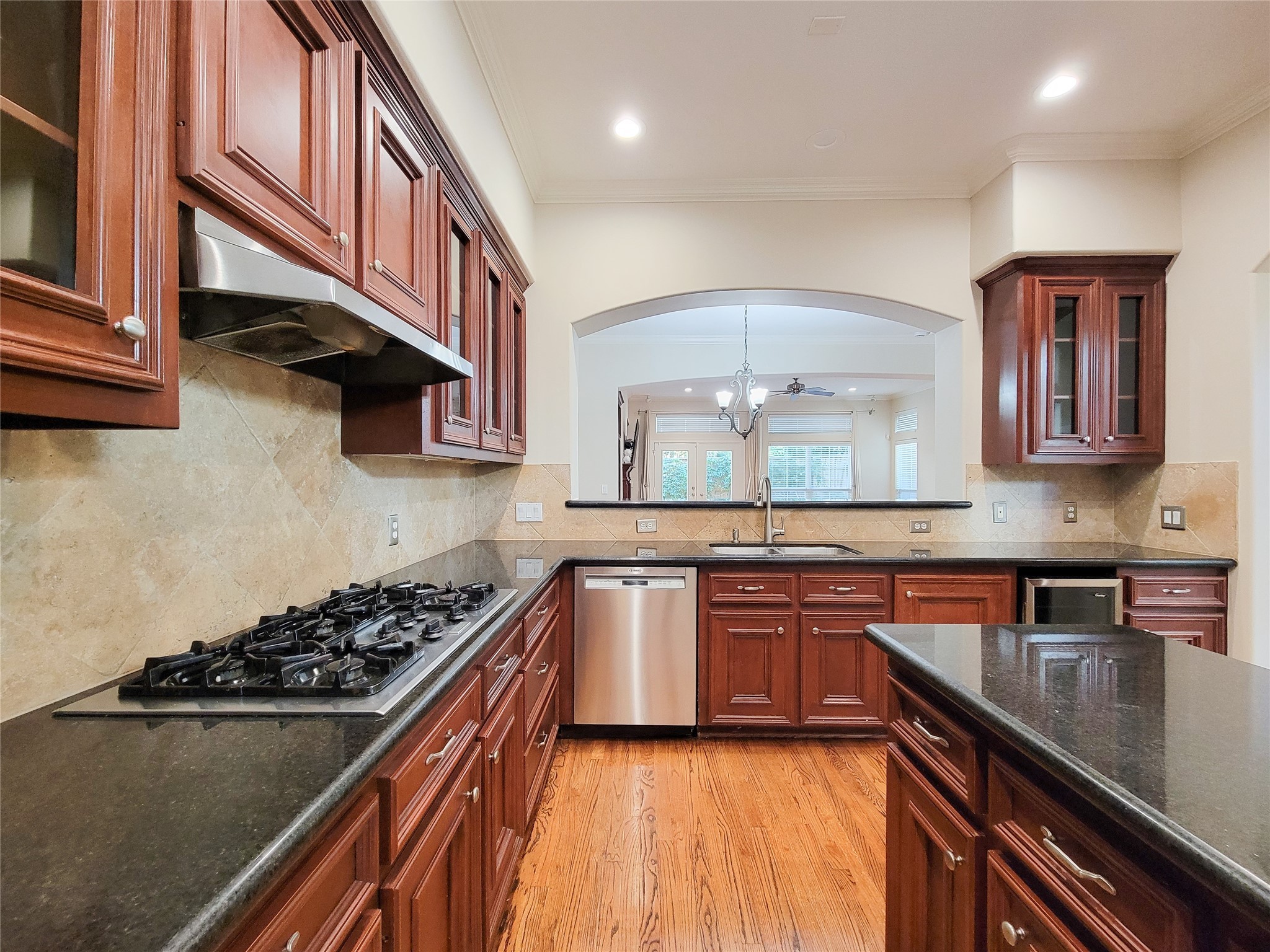 5514 Feagan Street Houston, TX 77007 - Photo 8 of 48 a kitchen with stainless steel appliances granite countertop a sink a stove and a wooden cabinets