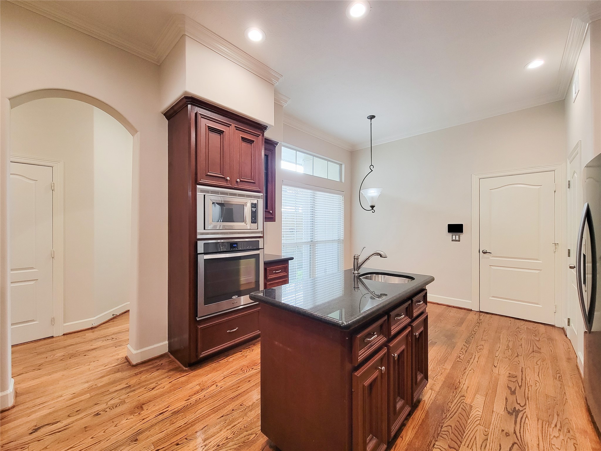 5514 Feagan Street Houston, TX 77007 - Photo 10 of 48 a kitchen with granite countertop a refrigerator and a sink