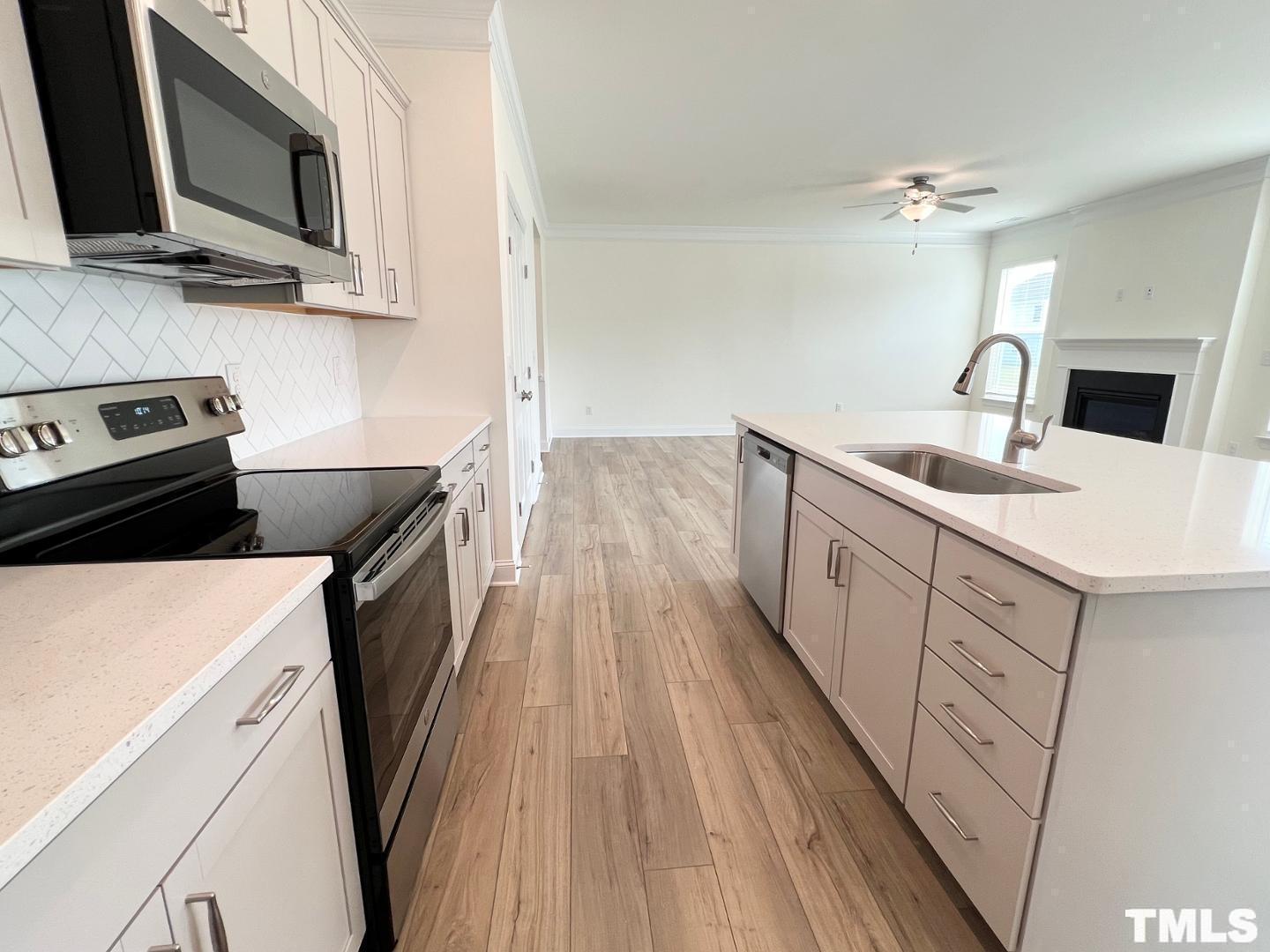 324 Highview Drive Benson, NC 27504 - Photo 5 of 12 a kitchen with a sink stove and microwave