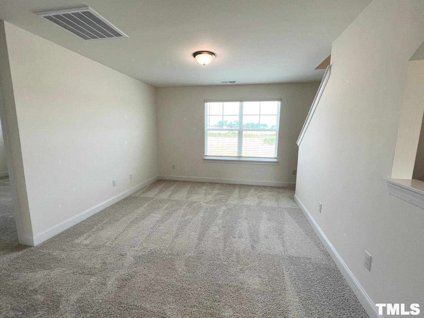 324 Highview Drive Benson, NC 27504 - Photo 6 of 12 an empty room with a window