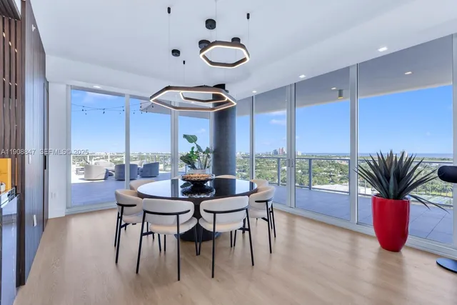 a dining room with furniture and window