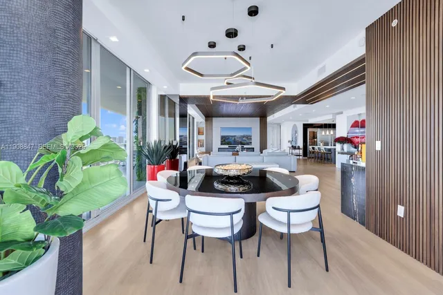 a bathroom with a toilet and a shower curtain