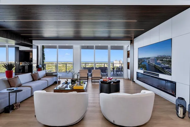 a bedroom with furniture and a flat screen tv