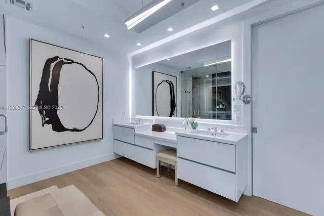 a view of entryway with a potted plant and a bathroom