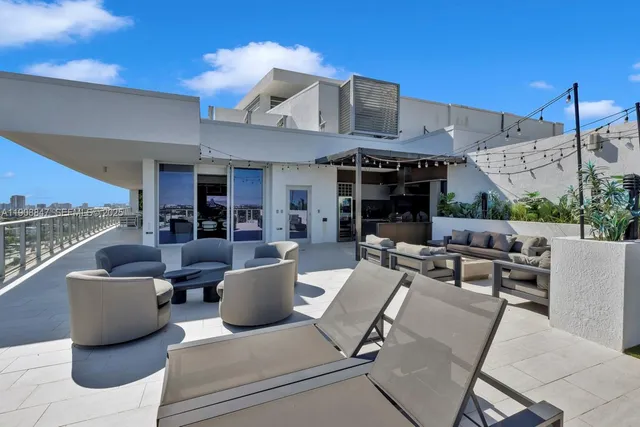 a outdoor living space with furniture and a ceiling fan