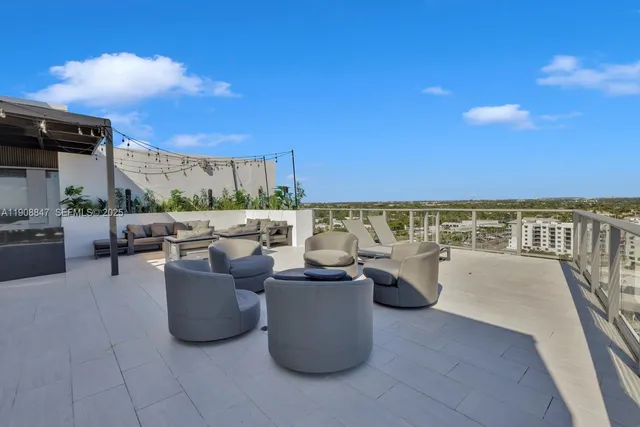 a kitchen view with a stove a chimney and a window