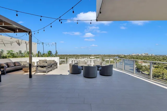 a view of a chairs and table in patio with a garden