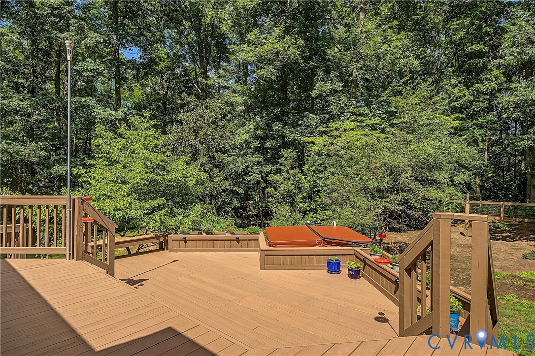 2431 Magnolia Ridge Maidens, VA 23102 - Photo 33 of 43 Freshly painted three-tier deck surrounded by wood