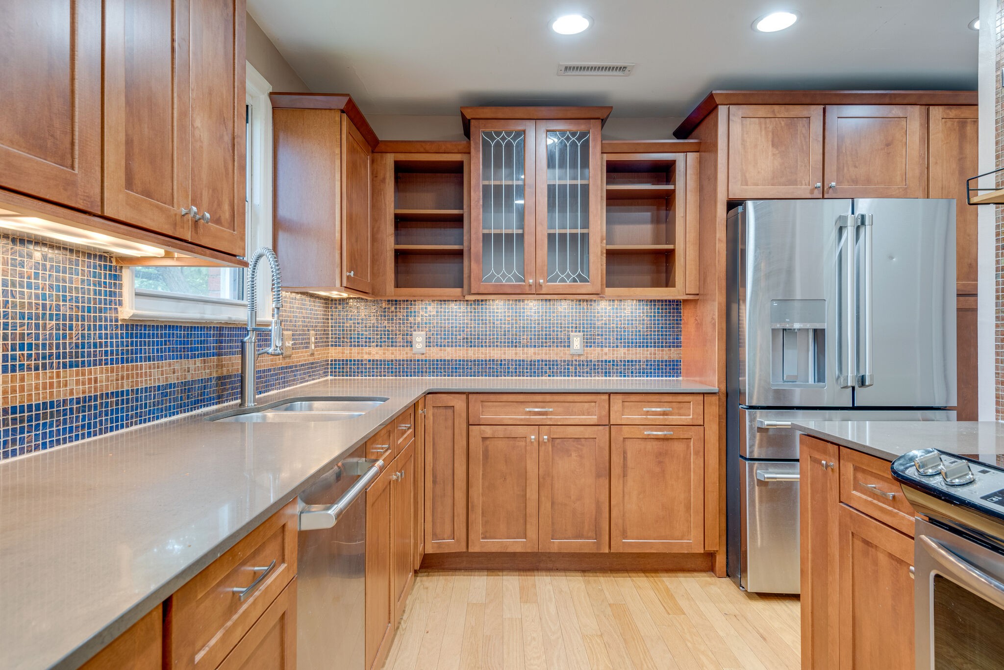 1021 Mitchell Road Nashville, TN 37206 - Photo 12 of 29 a kitchen with stainless steel appliances granite countertop a refrigerator and a stove top oven