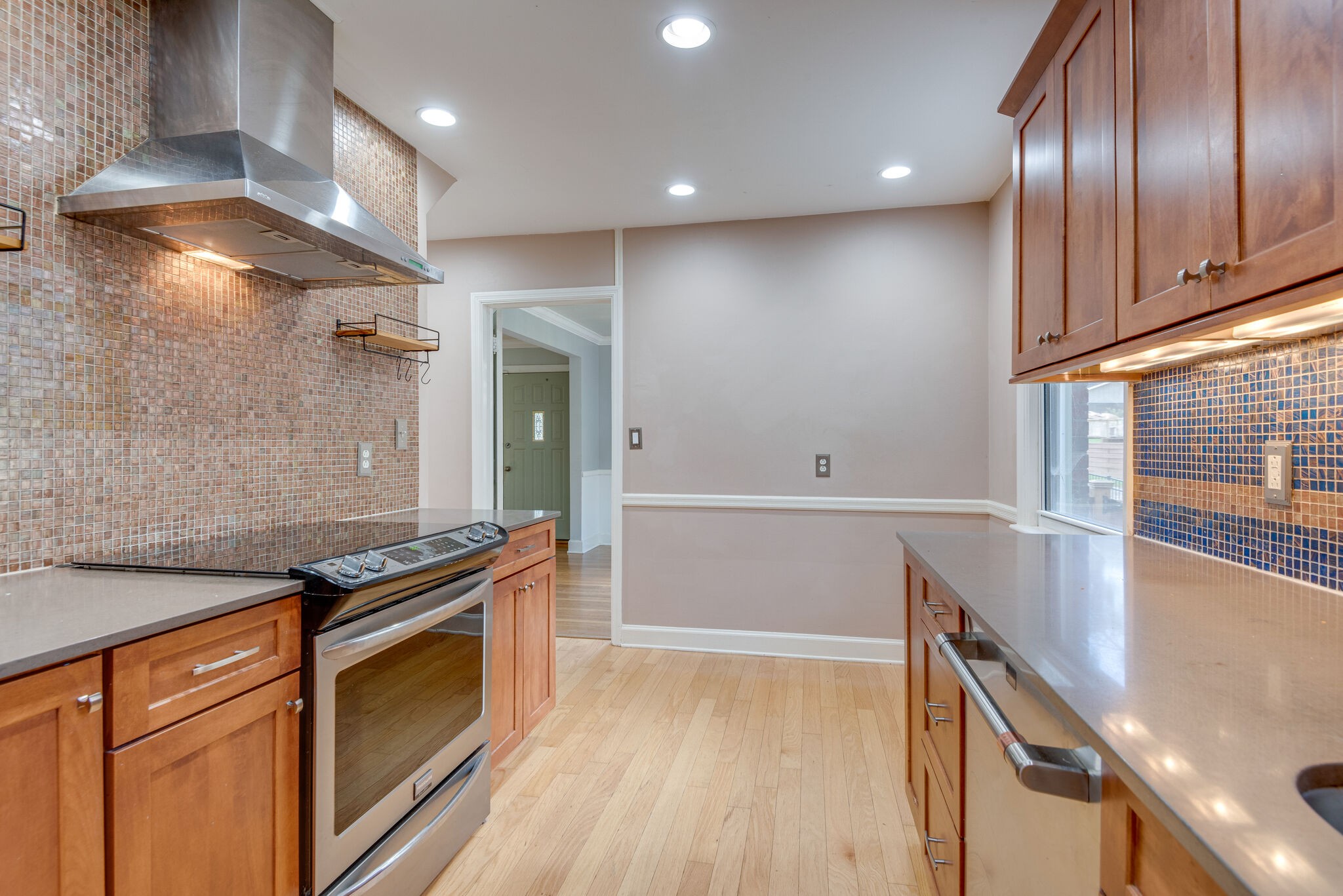 1021 Mitchell Road Nashville, TN 37206 - Photo 14 of 29 a kitchen with granite countertop stainless steel appliances a stove top oven and sink