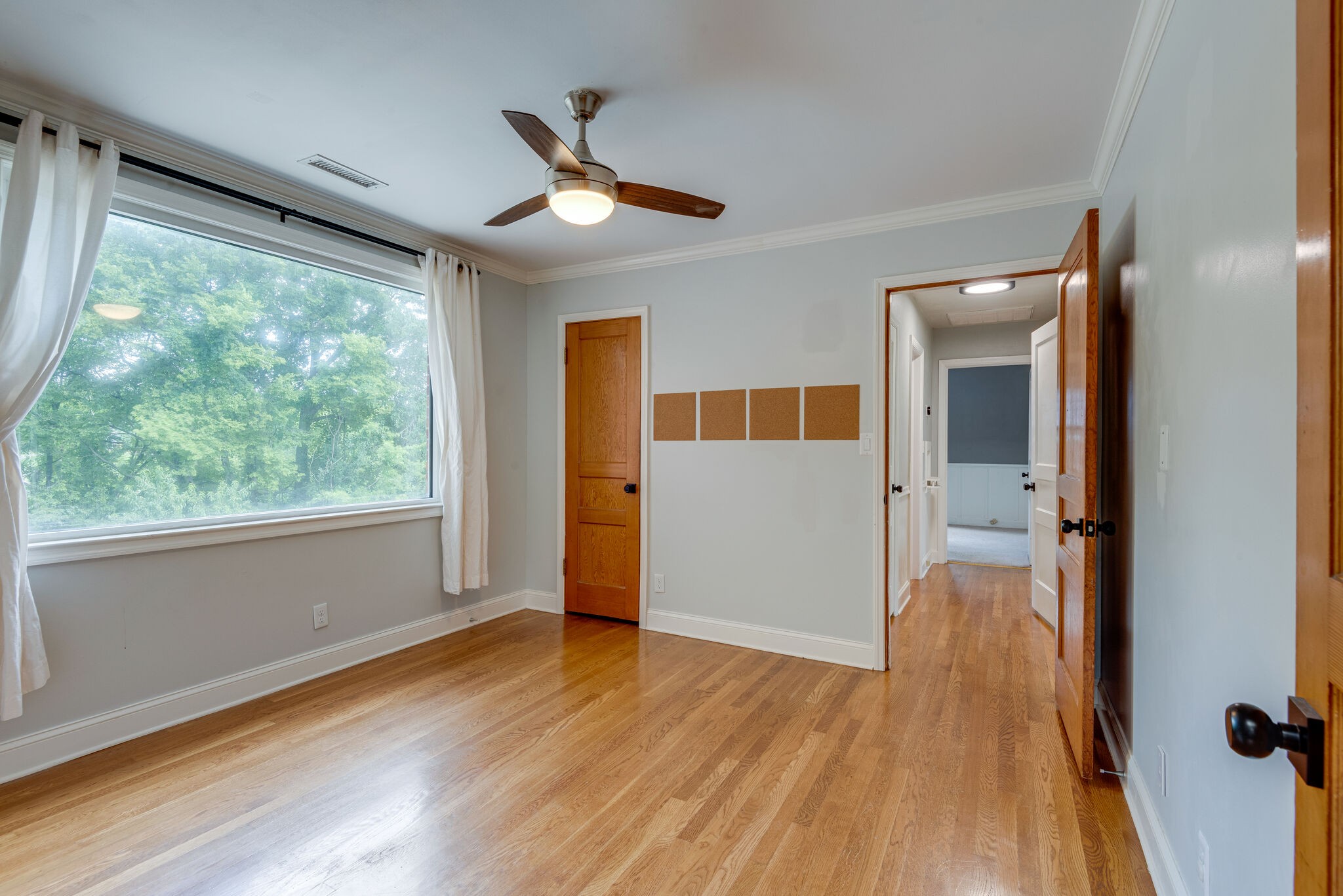 1021 Mitchell Road Nashville, TN 37206 - Photo 15 of 29 a view of empty room with wooden floor and fan