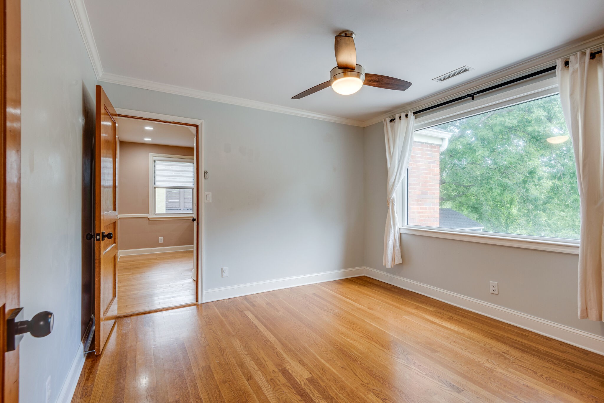 1021 Mitchell Road Nashville, TN 37206 - Photo 16 of 29 a view of empty room with wooden floor and fan