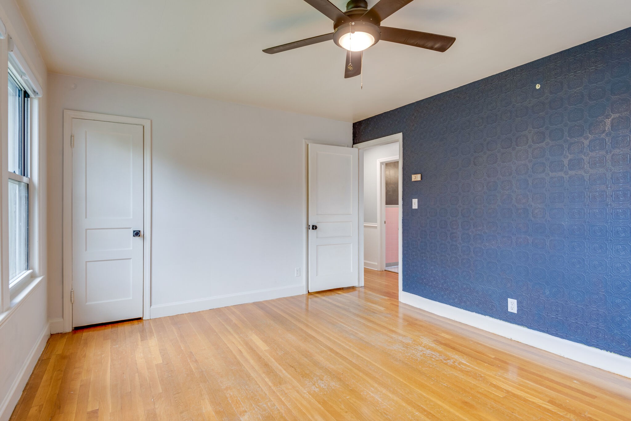 1021 Mitchell Road Nashville, TN 37206 - Photo 19 of 29 an empty room with a ceiling fan and wooden floor
