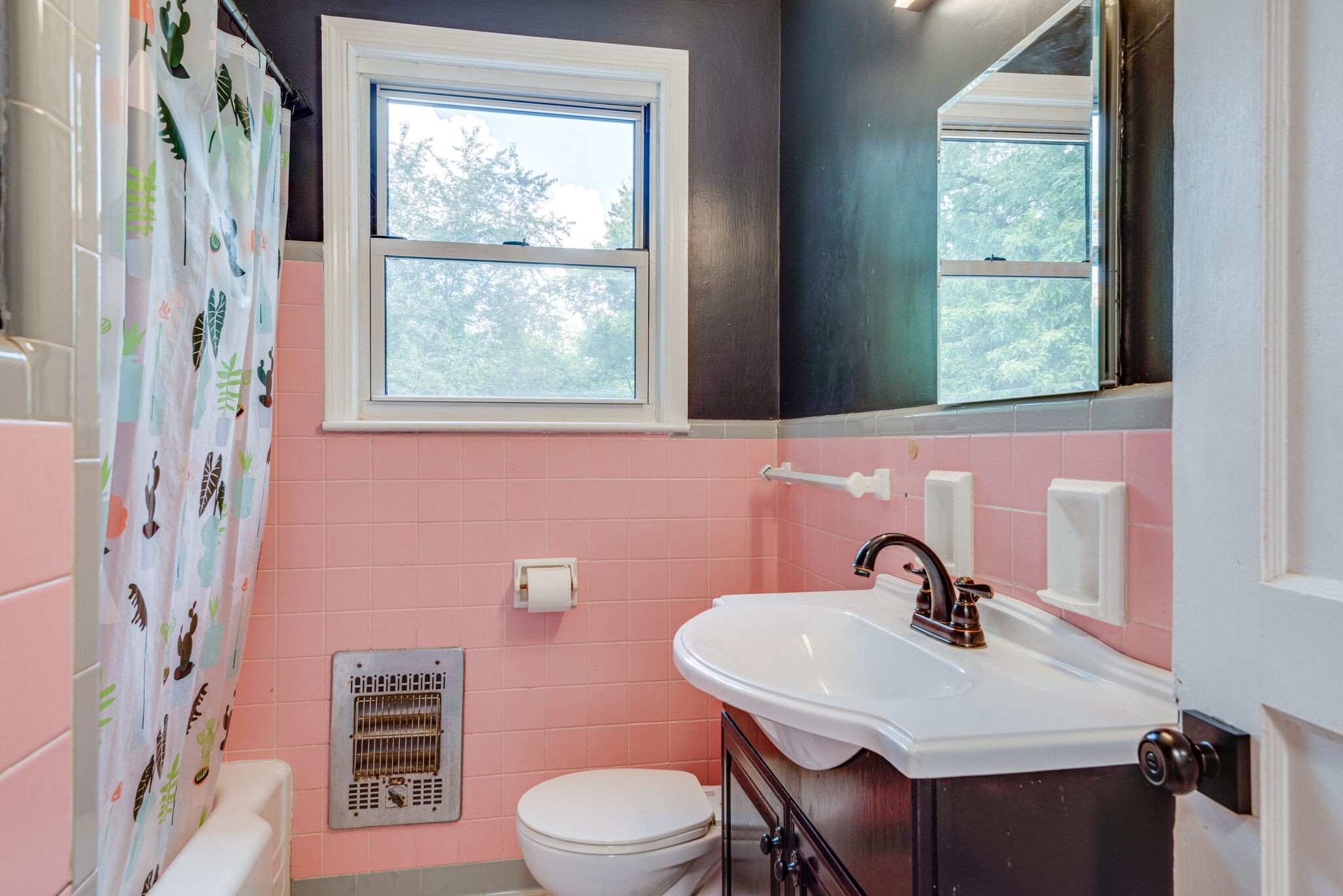 1021 Mitchell Road Nashville, TN 37206 - Photo 20 of 29 a bathroom with a sink a toilet and a window