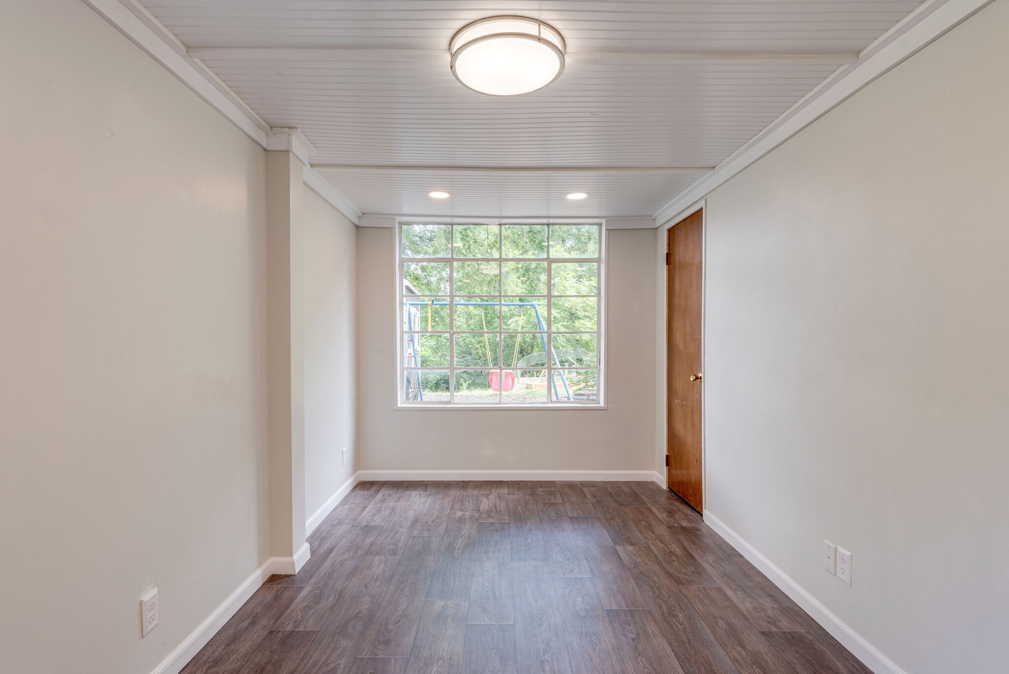 1021 Mitchell Road Nashville, TN 37206 - Photo 25 of 29 an empty room with wooden floor and windows