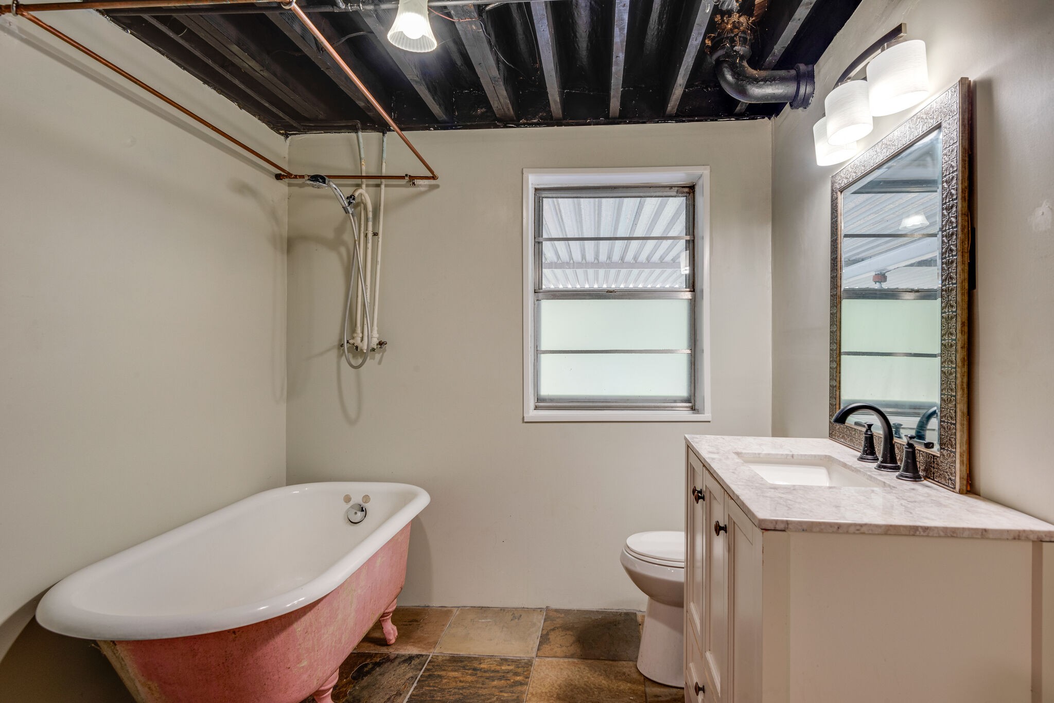 1021 Mitchell Road Nashville, TN 37206 - Photo 26 of 29 a bathroom with a toilet a sink and a mirror