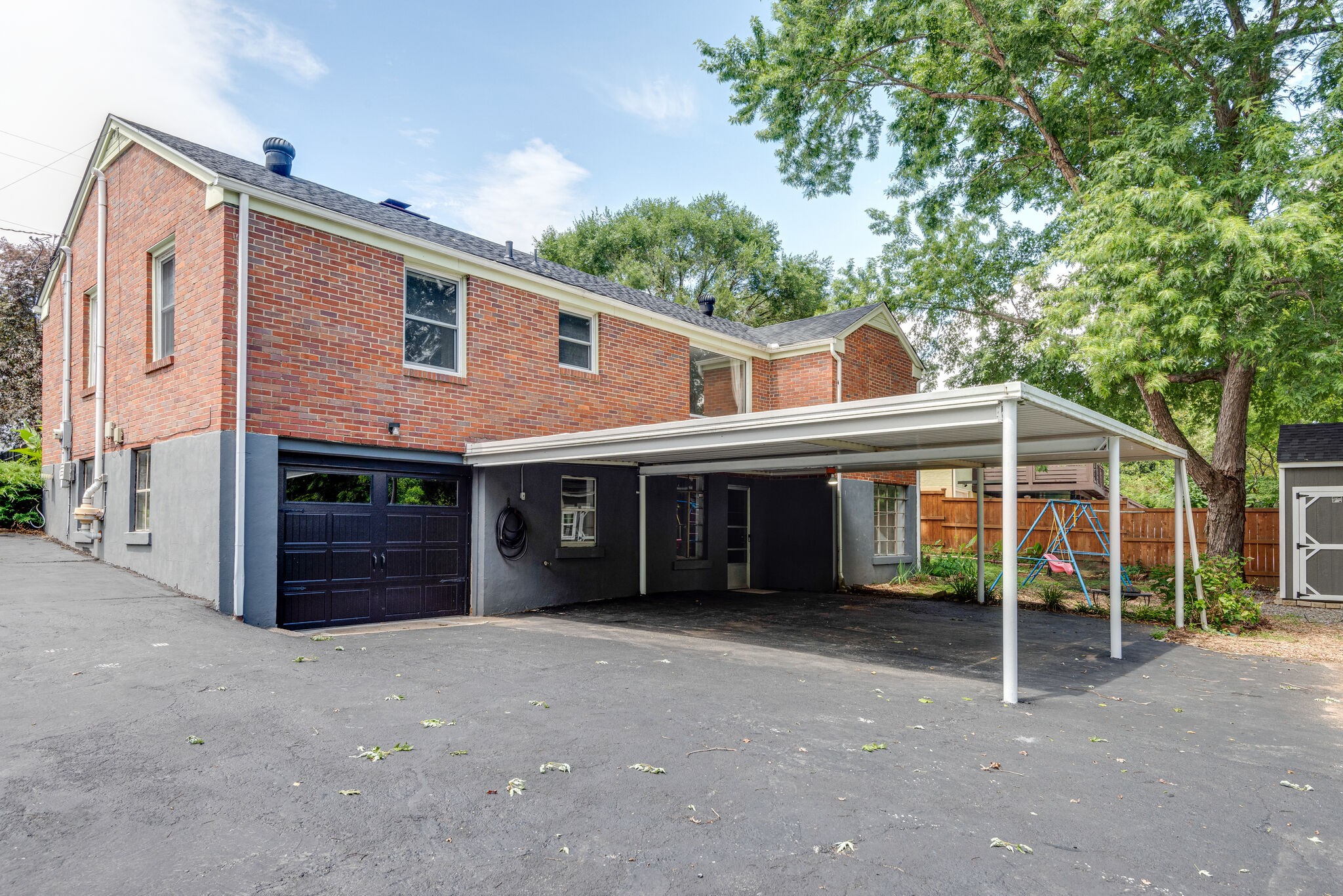 1021 Mitchell Road Nashville, TN 37206 - Photo 28 of 29 a view of a house with a yard and large windows