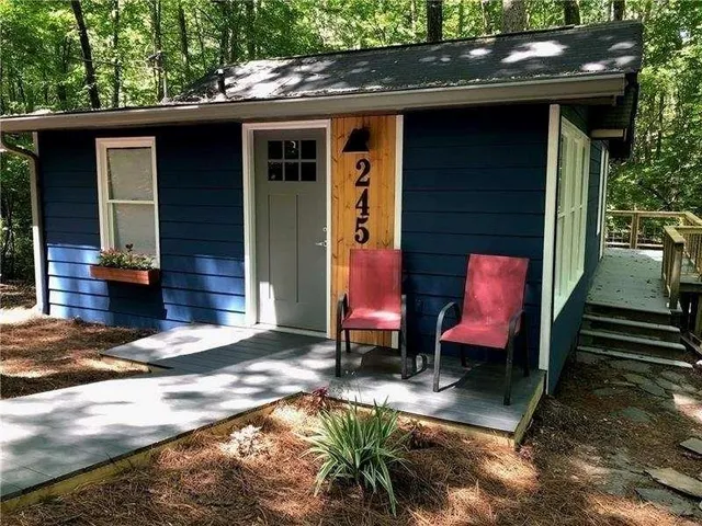 a backyard of a house with seating space