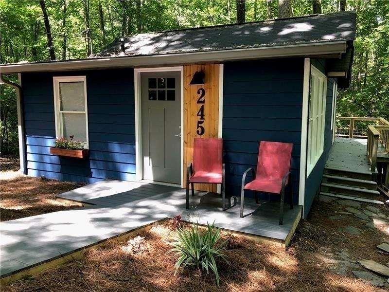 245 Hilton Way Canton, GA 30114 - Photo 1 of 13 a backyard of a house with seating space