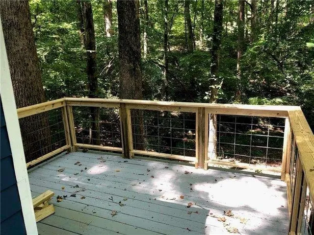 a view of wooden deck with a backyard