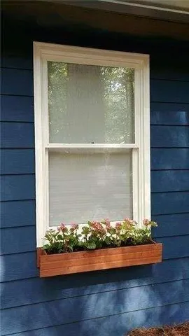 a view of room with wooden floor and cabinet