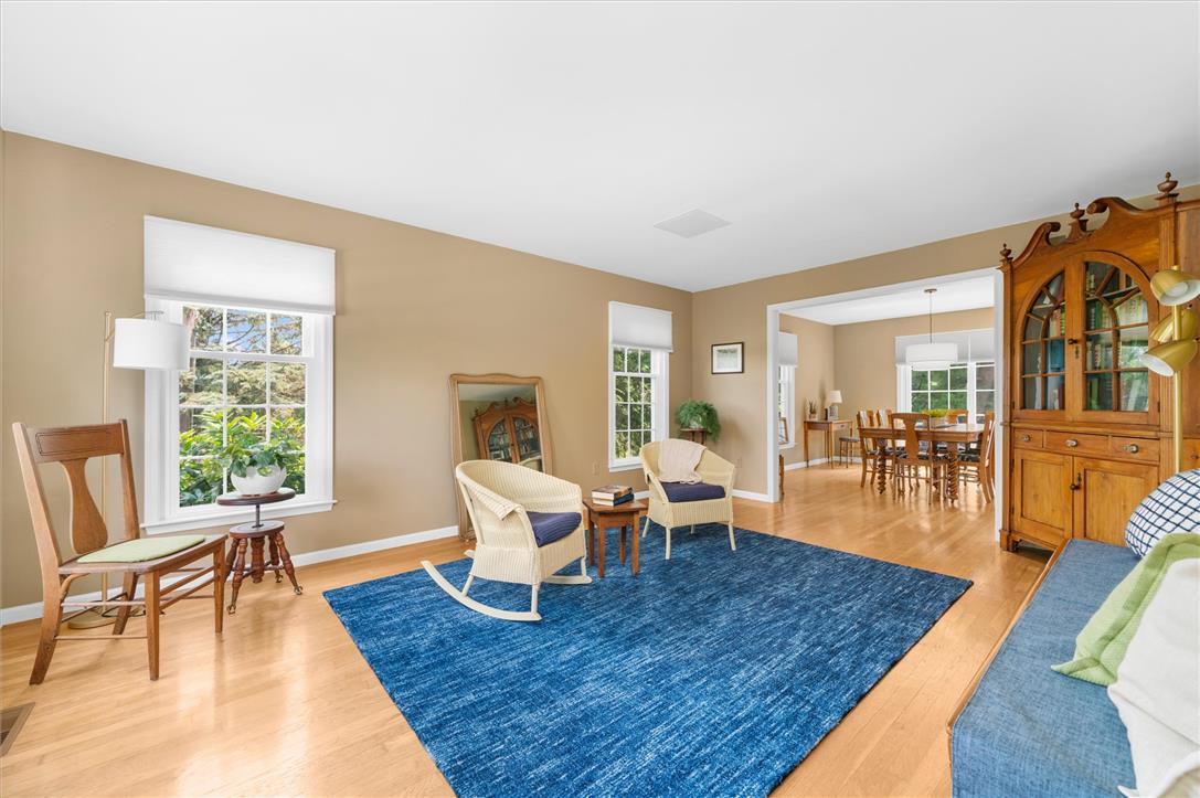 5616 Snowdrift Road Orefield, PA 18069 - Photo 10 of 36 Bright windows frame verdant outdoor views in this welcoming living area, featuring gleaming hardwood floors.