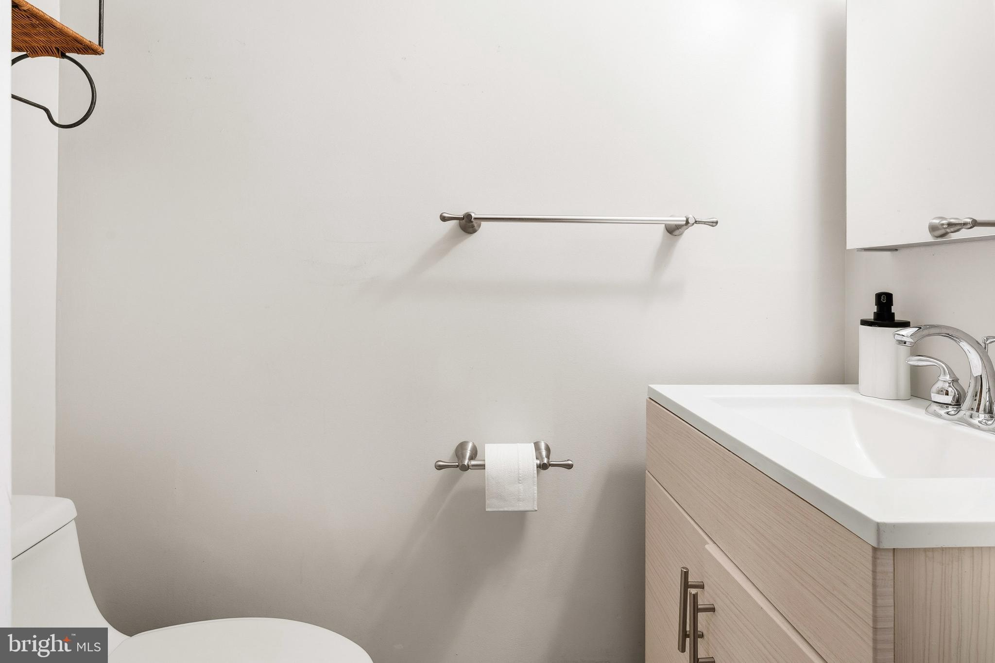 7641 Laytonia Drive Gaithersburg, MD 20877 - Photo 12 of 31 a bathroom with a sink vanity and toilet