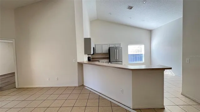 a kitchen with a sink cabinets and window