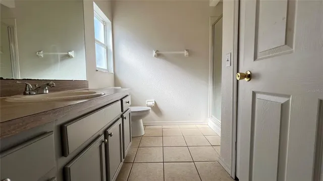 a bathroom with a sink a vanity and a mirror