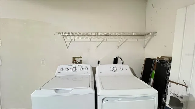 a utility room with dryer and washer