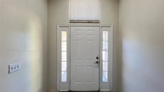 view of a utility room with closet