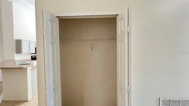 a view of a kitchen from a hallway