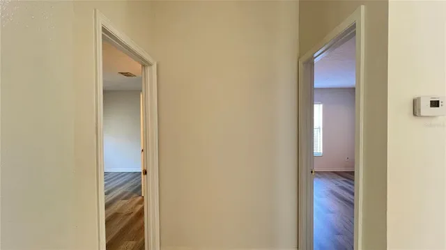 a view of a bathroom from a corridor