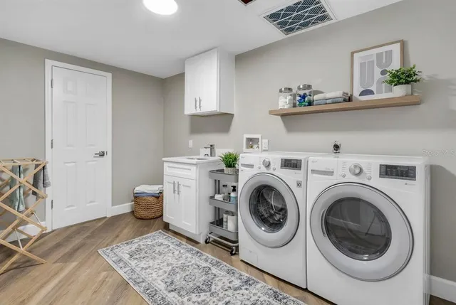 a view of kitchen with furniture and wooden floor