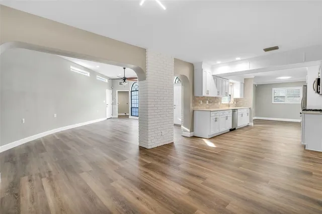 a view of kitchen and wooden floor