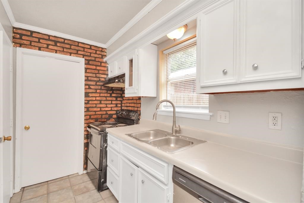 4803 Beechaven Street Houston, TX 77053 - Photo 20 of 30 a kitchen with a sink and a window