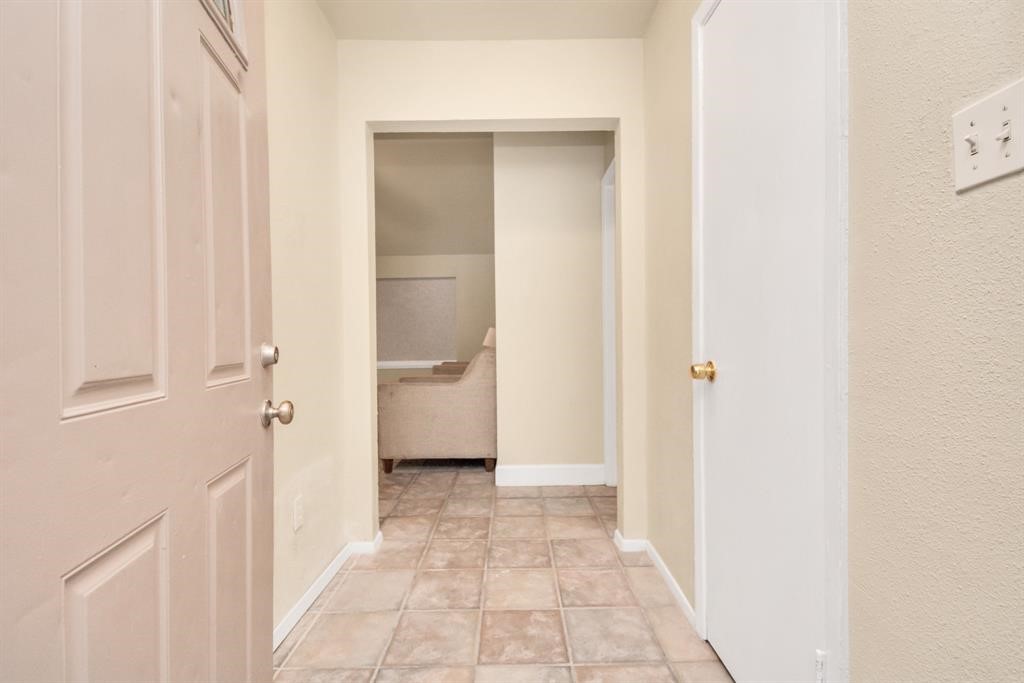 4803 Beechaven Street Houston, TX 77053 - Photo 3 of 30 a view of a bathroom from a hallway
