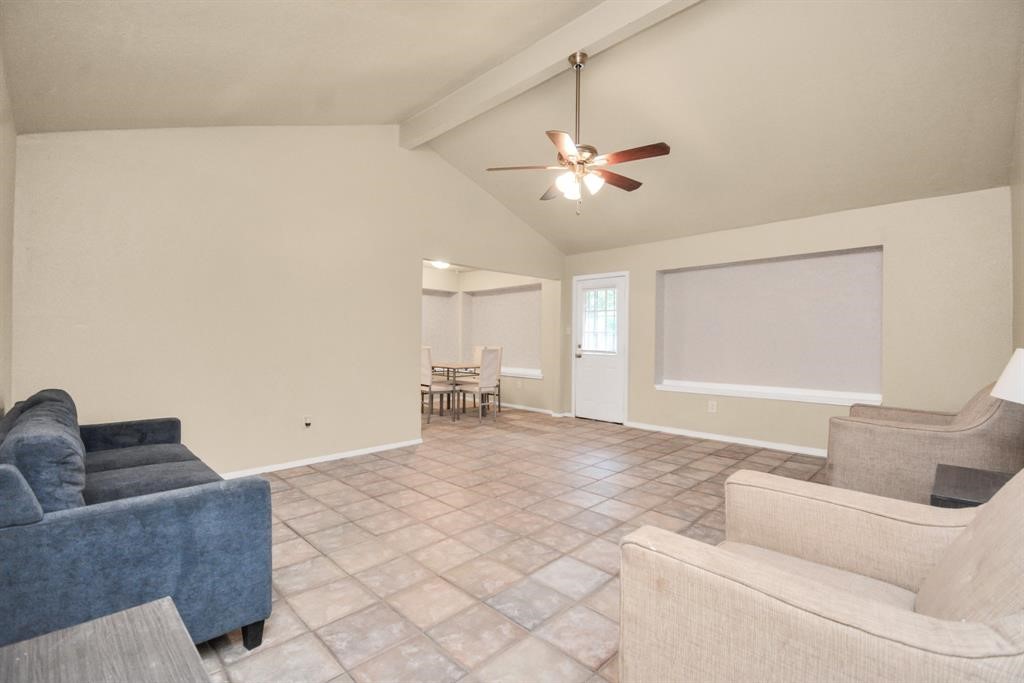 4803 Beechaven Street Houston, TX 77053 - Photo 4 of 30 a living room with furniture and a ceiling fan