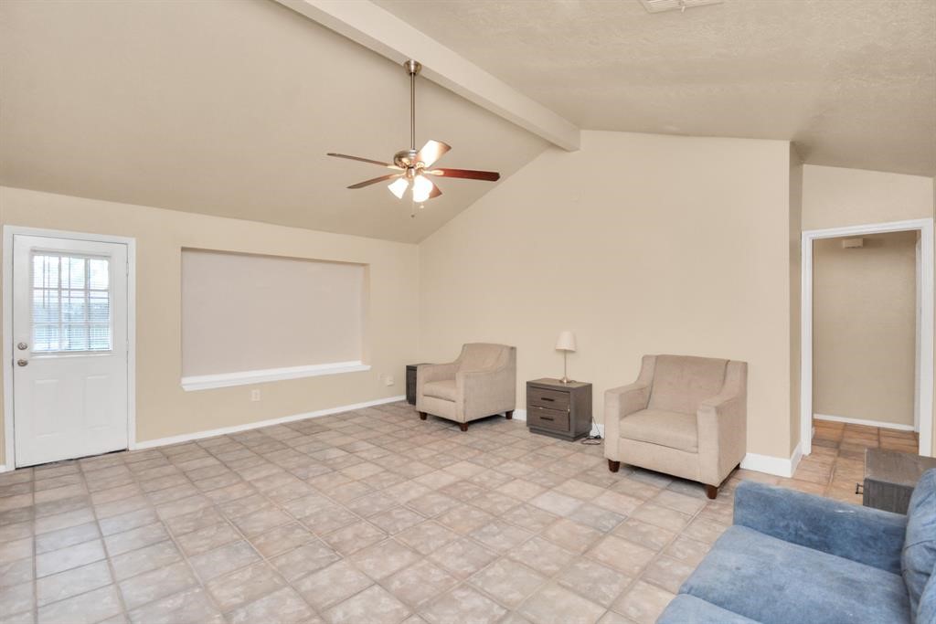 4803 Beechaven Street Houston, TX 77053 - Photo 5 of 30 a living room with furniture and a ceiling fan