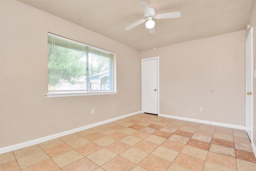 4803 Beechaven Street Houston, TX 77053 - Photo 9 of 30 a view of an empty room with a window