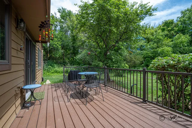 a view of balcony with deck and wooden floor