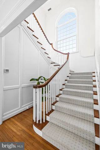 a kitchen with a sink and a large mirror